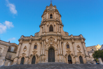 Facade of the beautiful sicilian baroque church Duomo of San Giorgio on a sunny day, Modica,...