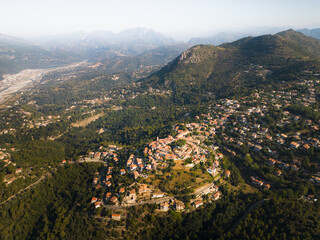 Obraz premium Nice at the foot of the Alpine mountains, photo view from a drone on a summer morning.