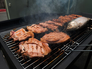 Garage BBQ: Pork and Bangus Fish Grilling Together and making Delicious Fragrant Smoke.