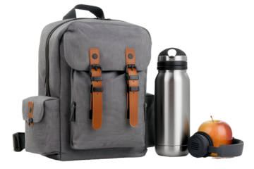 back to school backpack with water bottle, headphones and a apple for the teacher, isolated transparent png background