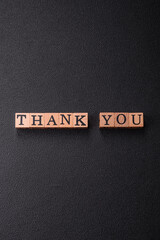 Inscription Thank you with wooden cubes, conceptual background with copy space