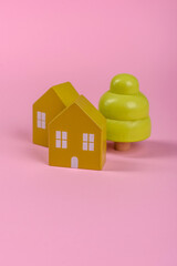 Wooden toy house as a conceptual background for purchasing real estate