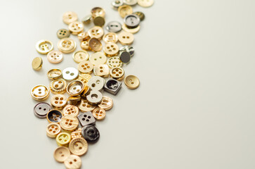A pile of buttons of various shapes and sizes