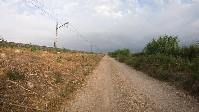Camino del Ebro - a dirt road along the railway leaving Quinto, province of Zaragoza, Aragon, Spain