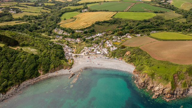 Aerial view of the Cornish fishing village of Porthallow with its pebble beach