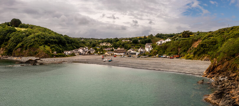 Aerial view of the Cornish fishing village of Porthallow with its pebble beach