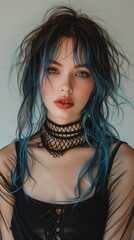 Blue haired Goth model in fishnet top, fashion and make-up portrait shoot. Gothic, Goth, Emo, New Wave, Dark style fashion. Dark smokey make-up, red lipstick. Dramatic. Elegant.	
