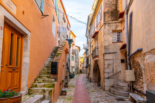 Fototapeta The narrow residential streets and alleys in the medieval old town of the village of La Turbie, France, in the Provence Cote d'Azur region of the French Riviera. 