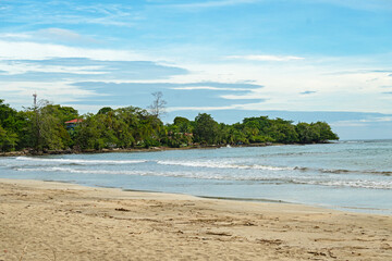 sand beach in the Cahuita National Park in Costa Rica with view towards Cahuita