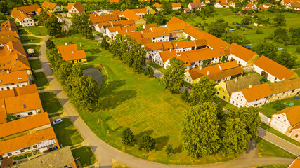Aerial view of village Holasovice. South Bohemian folk or rural Baroque style architecture from...