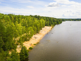 Aerial view of beach on a lake. Reclaimed sand pit and popular tourists destination piskovna Vlkov near Veseli nad Luznici. South Bohemia, Czech republic, European union.