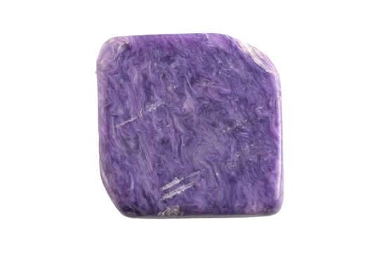 natural violet charoite gem on the white isolated background