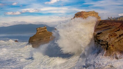 Big waves crashing on the sandstone rocks at Cape Kiwanda at Pacific City on the north Oregon coast