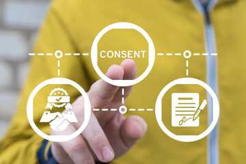 Man working on virtual touch screen presses word: CONSENT. Medical informed consent concept. Data...