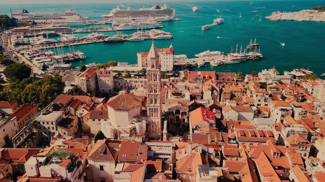 Aerial Drone View of Split, Croatia During Sunset in the Summer with the port and Adriatic Sea in the background. 