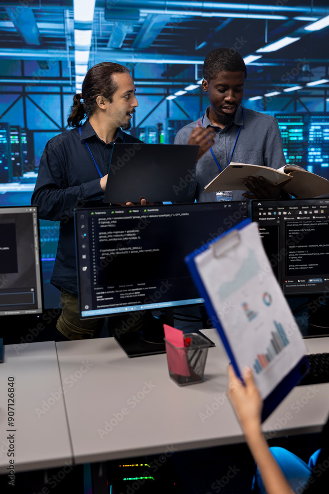 Poster man inspecting server hub infrastructure, reading paperwork from folder, talking with workers. super