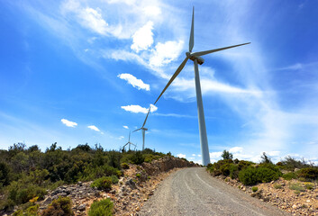 Wind turbine in mountains landscape. Eolic park windpower. Wind farm, New Wind green energy. Wind turbines alternative energy. Windmill power clean electricity generation. Spain Windfarm in Castellon