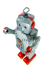 A very antique tin robot toy airplane isolated in white with clipping path.
Retro gray and red...