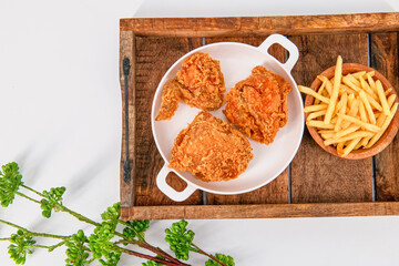 crispy Fried chicken  with french fries on isolated background, chicken broasted with potato chips, Broasted chicken is battered and cooked in oil as well, crispy fried chicken.