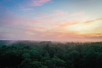 Boothbay Harbor West at sunset in Summer with a foggy mist aerial drone