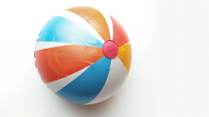 Fototapeta premium A brightly colored beach ball with segments in red, blue, orange, and white, presented against a simple white background, evoking summertime joy and play.