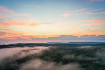 Boothbay Harbor West at sunset in Summer with a foggy mist aerial drone