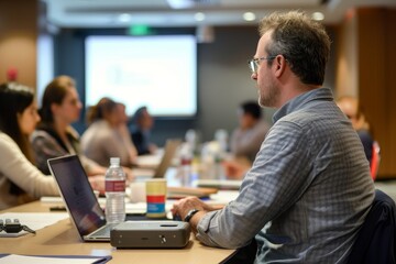 a classroom full of students with computers and laptops, productivity boot camp provides intensive training to boost effectiveness and efficiency