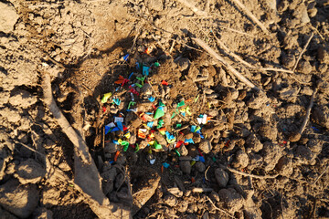 Microplastic pollution. Microplastics in ground. Soil contaminated with microplastics. Plastic...