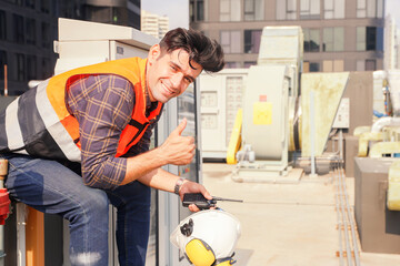 Male worker AVC refrigeration system technician works hotel building Inspect refrigeration...