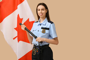 Female police officer with baton and flag of Canada on beige background