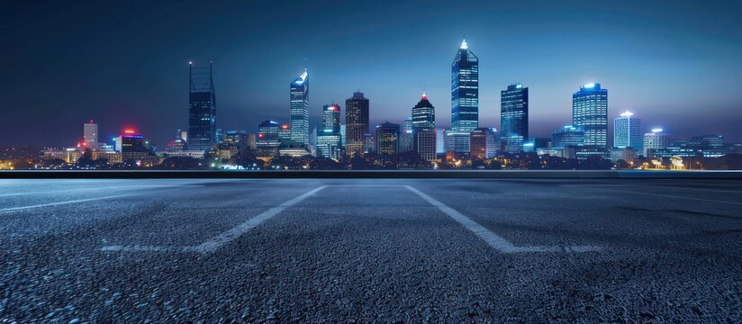 Empty parking lot with modern cityscape at night, ideal for product placement, urban background, or cinematic scene.