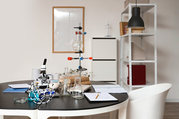 Table with different scientific equipment in medical laboratory