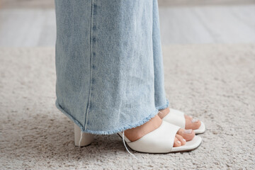 Woman standing on soft carpet. New beginning concept