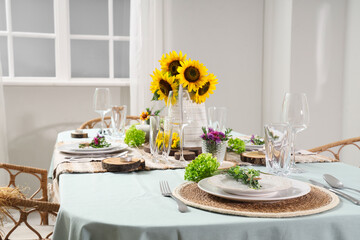 Served dining table with beautiful sunflowers and floral decor