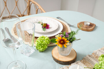 Beautiful table serving with floral decor, closeup