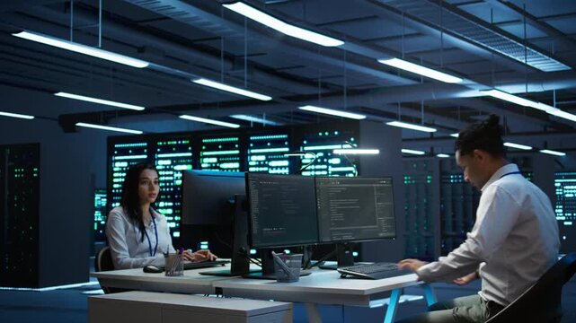 Engineer in data center installing software on computer, troubleshooting issues, handheld camera shot. IT professional in server hub establishing performance benchmarks, camera B