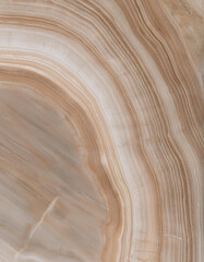 Obraz premium Marble texture with swirling patterns in shades of brown, beige, and white. Classic and elegant background design suitable for a variety of creative and decorative projects.