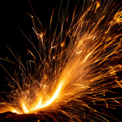 highly detailed rendering of fire sparks isolated on a black background, capturing the intricate glow and movement of the sparks.