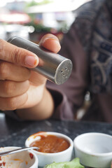 Salt falls from a salt shaker 