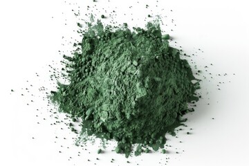 A pile of green powder sits on a clean white surface, awaiting use