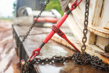 Steel chain and hook securing anchor, using to secure heavy object that transported on the trailer...