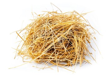 A pile of hay sits atop a white surface, ideal for rustic or farm-themed uses