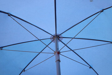 A canopy for protection from the hot sun in a city park.