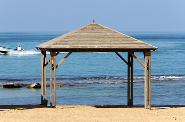 A canopy for protection from the hot sun in a city park.