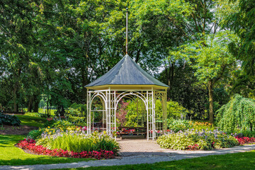 Summerhouse in Shakespearean Garden in Stratford Ontario. Old architectural style metal Gazebo in...