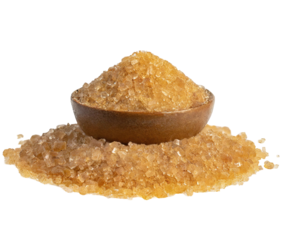 Brown rock sugar in a wooden bowl and scattered around. Ideal for cooking, baking, and confectionery. Isolated on white background.