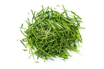 A pile of fresh green grass on a white surface