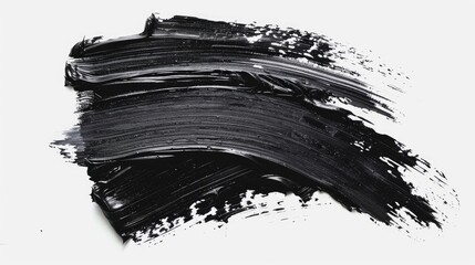 A close-up shot of black paint on a white surface