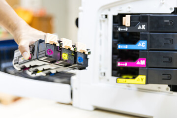 Technician choose ink cartridges of printer toner low to replace new and fix repair problem paper...