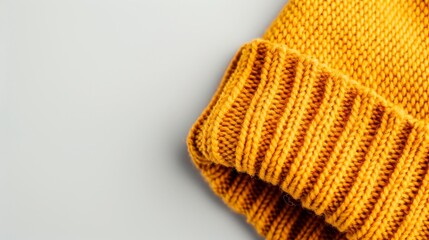 Detailed image of a warm knitted beanie with a prominent logo, isolated on a clean background, providing space for text or marketing elements